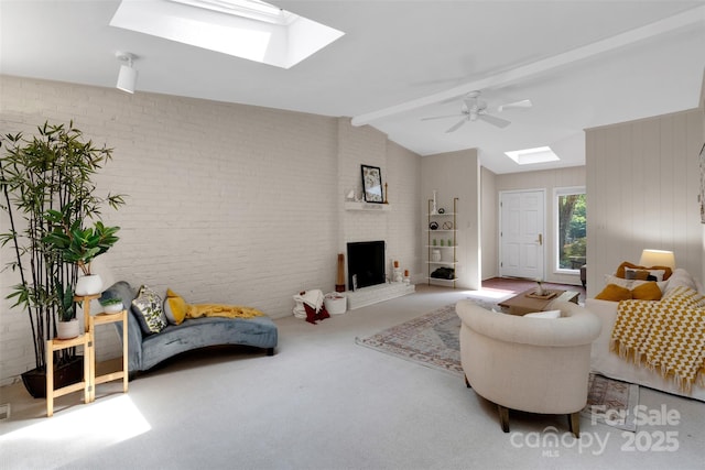 331 Glen Oaks Rd, Charlotte, NC 28270 - living room with a skylight, brick wall, carpet floors, and a ceiling fan