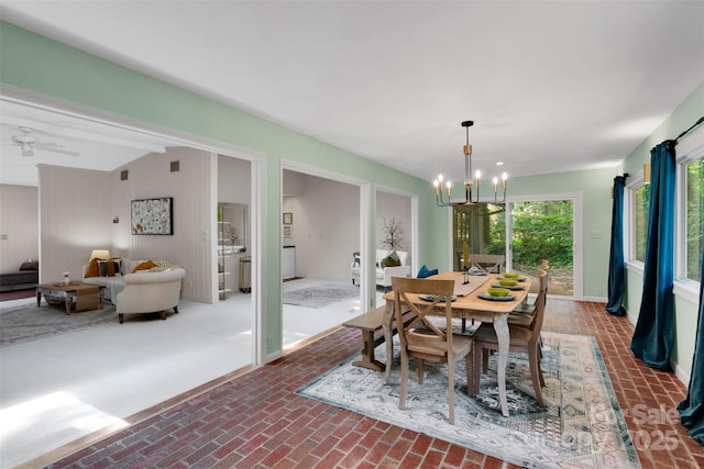 331 Glen Oaks Rd, Charlotte, NC 28270 - dining space with a chandelier, brick patterned flooring, and baseboards