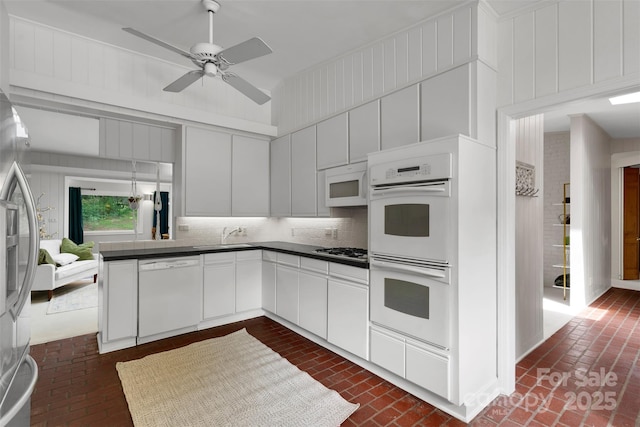 331 Glen Oaks Rd, Charlotte, NC 28270 - kitchen with stainless steel appliances, brick floors, and dark countertops