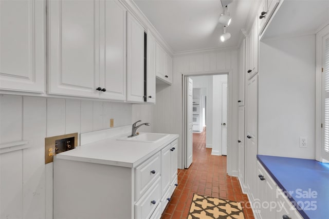 331 Glen Oaks Rd, Charlotte, NC 28270 - laundry area with cabinet space, brick floors, and washer hookup