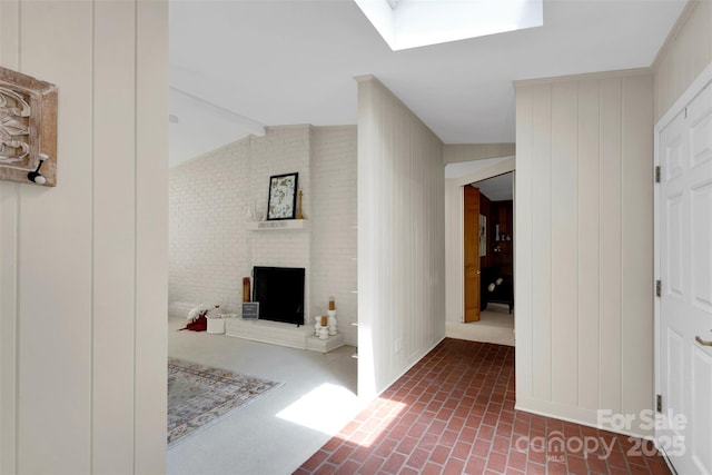 331 Glen Oaks Rd, Charlotte, NC 28270 - corridor featuring brick floors, a skylight, and beam ceiling