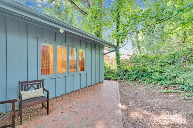 331 Glen Oaks Rd, Charlotte, NC 28270 - view of home's exterior with board and batten siding and a patio area