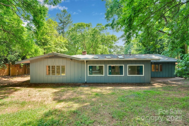 331 Glen Oaks Rd, Charlotte, NC 28270 - back of house featuring a chimney and board and batten siding