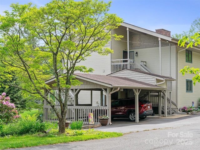 301 Fairway Ln, Spruce Pine, NC 28777 - view of front of house featuring a carport, a chimney, and driveway