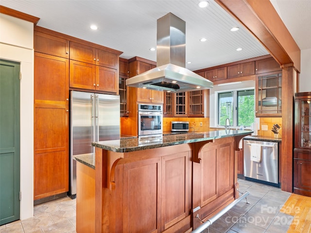 301 Fairway Ln, Spruce Pine, NC 28777 - kitchen with stainless steel appliances, island exhaust hood, recessed lighting, glass insert cabinets, and a kitchen bar