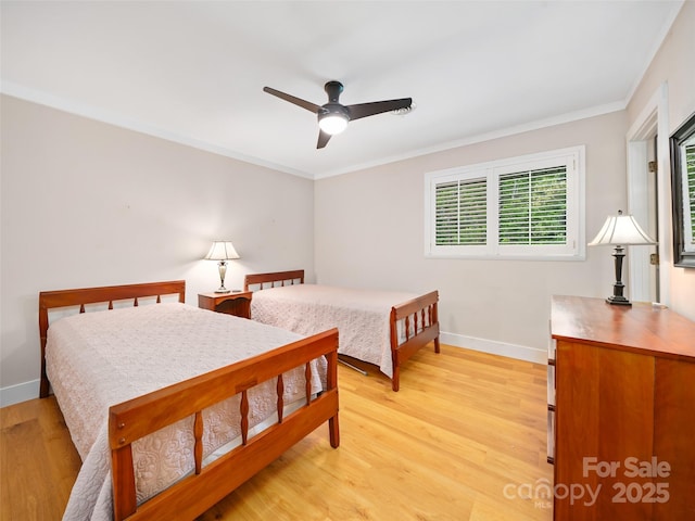 301 Fairway Ln, Spruce Pine, NC 28777 - bedroom with multiple windows, baseboards, light wood-type flooring, and crown molding