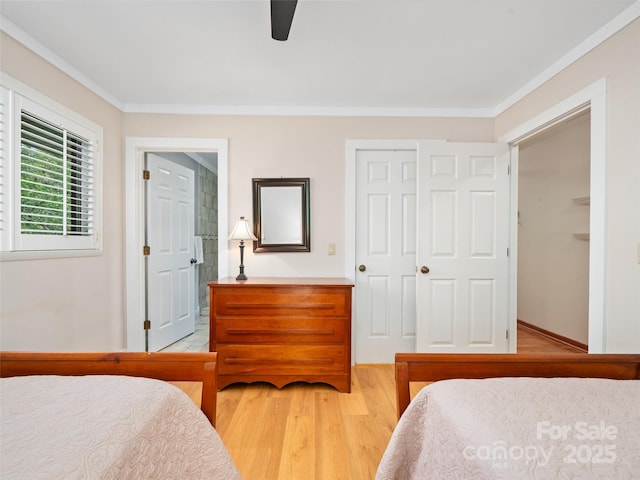 301 Fairway Ln, Spruce Pine, NC 28777 - bedroom with light wood finished floors, ornamental molding, a ceiling fan, and a closet