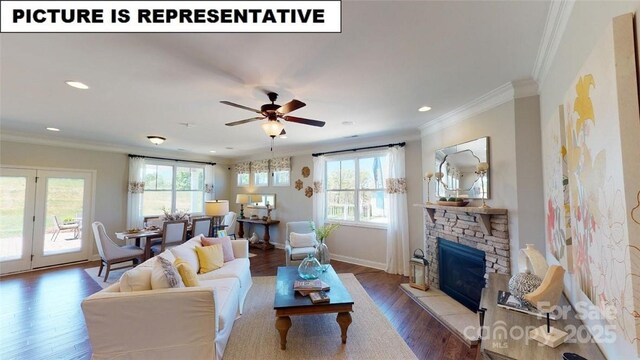 124 S Shayna Rd, Troutman, NC 28166 - living area featuring wood finished floors, recessed lighting, crown molding, baseboards, and a fireplace