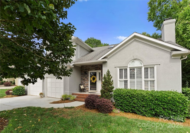 4101 Fairway Downs Ct Unit 9, Charlotte, NC 28277 - view of front of house featuring a chimney, concrete driveway, stone siding, stucco siding, and a garage