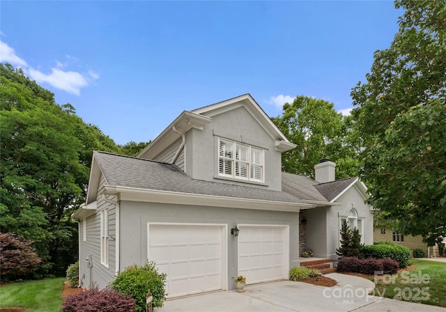 4101 Fairway Downs Ct Unit 9, Charlotte, NC 28277 - traditional-style home featuring driveway, stucco siding, a chimney, a shingled roof, and a garage