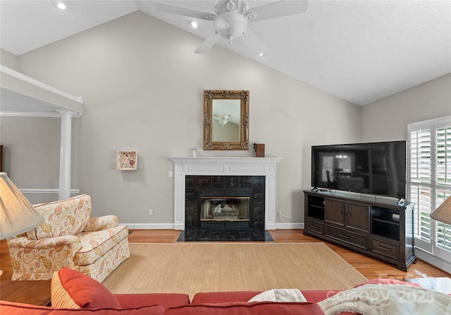 4101 Fairway Downs Ct Unit 9, Charlotte, NC 28277 - living area with wood finished floors, a ceiling fan, a fireplace, high vaulted ceiling, and recessed lighting