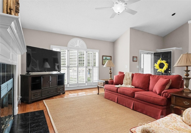 4101 Fairway Downs Ct Unit 9, Charlotte, NC 28277 - living area with wood finished floors, a ceiling fan, and lofted ceiling