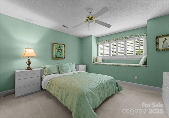 4101 Fairway Downs Ct Unit 9, Charlotte, NC 28277 - bedroom with carpet, a textured ceiling, baseboards, and ceiling fan