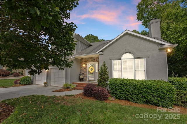4101 Fairway Downs Ct Unit 9, Charlotte, NC 28277 - view of front of property with concrete driveway, a chimney, stone siding, stucco siding, and an attached garage