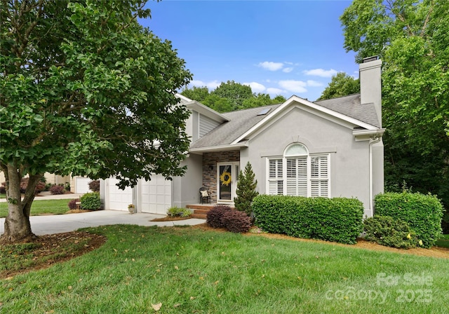 4101 Fairway Downs Ct Unit 9, Charlotte, NC 28277 - view of front facade featuring concrete driveway, stone siding, a chimney, a front yard, and roof with shingles