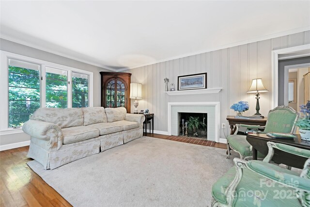 168 River Ridge Rd, Brevard, NC 28712 - living area featuring ornamental molding, a fireplace with flush hearth, and wood finished floors
