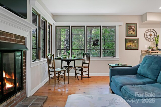 168 River Ridge Rd, Brevard, NC 28712 - living area with a brick fireplace and wood-type flooring