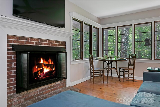 168 River Ridge Rd, Brevard, NC 28712 - living room with hardwood / wood-style floors, a fireplace, and healthy amount of natural light