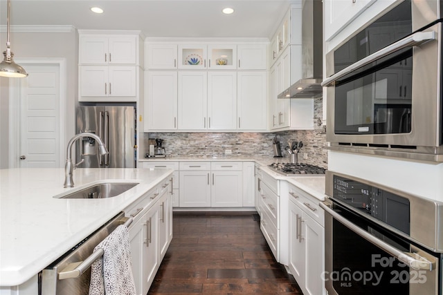 324 Squash Harvest Ct, Matthews, NC 28104 - kitchen with stainless steel appliances, a sink, wall chimney exhaust hood, recessed lighting, and crown molding