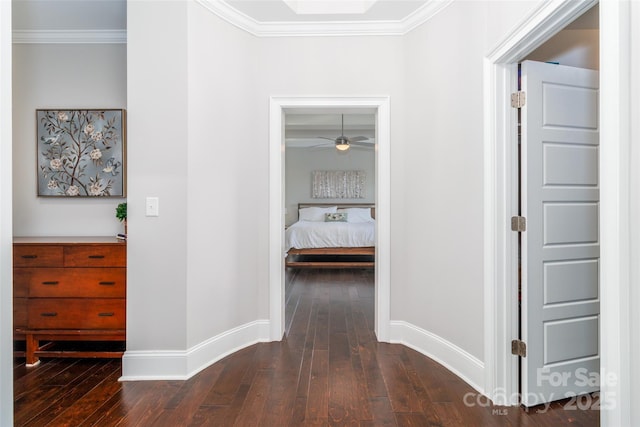 324 Squash Harvest Ct, Matthews, NC 28104 - hall featuring dark wood-type flooring, crown molding, and baseboards