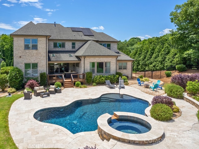 324 Squash Harvest Ct, Matthews, NC 28104 - view of swimming pool featuring outdoor lounge area, a wooden deck, a patio area, and a pool with connected hot tub