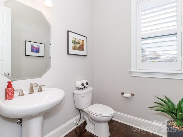 324 Squash Harvest Ct, Matthews, NC 28104 - half bath featuring baseboards, toilet, wood finished floors, and a sink