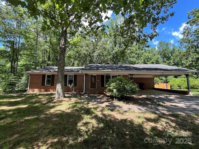 511 Evelyn Ave, Kannapolis, NC 28083 - view of front of property featuring brick siding, driveway, and an attached carport