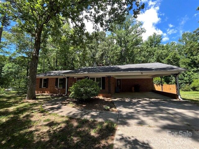 511 Evelyn Ave, Kannapolis, NC 28083 - single story home featuring driveway, brick siding, and an attached carport