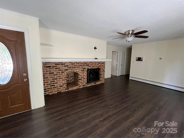 511 Evelyn Ave, Kannapolis, NC 28083 - foyer entrance featuring wood finished floors, ceiling fan, a baseboard radiator, a textured ceiling, and a fireplace