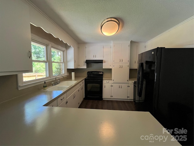 511 Evelyn Ave, Kannapolis, NC 28083 - kitchen with black appliances, a sink, under cabinet range hood, a textured ceiling, and white cabinets