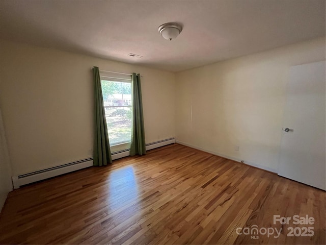 511 Evelyn Ave, Kannapolis, NC 28083 - empty room featuring wood finished floors and baseboard heating