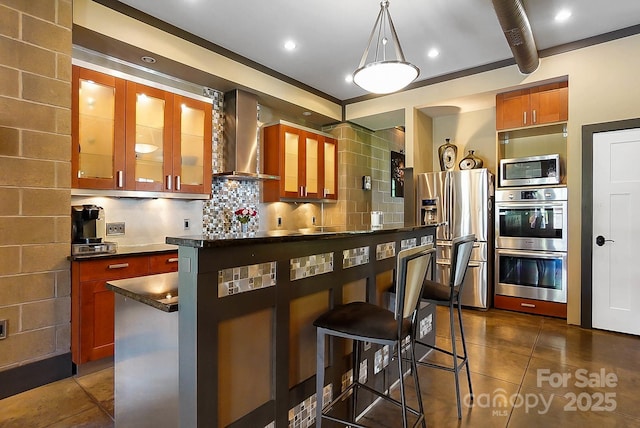 14701 Cabarrus Rd, Mint Hill, NC 28227 - kitchen with stainless steel appliances, wall chimney range hood, dark countertops, and dark tile patterned flooring