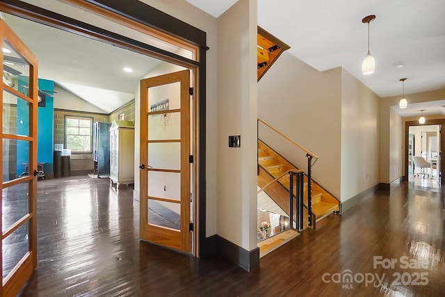 14701 Cabarrus Rd, Mint Hill, NC 28227 - corridor with wood finished floors, stairway, vaulted ceiling, and baseboards