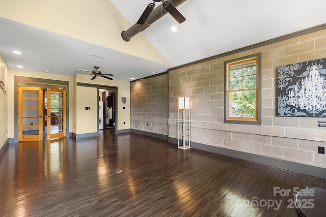 14701 Cabarrus Rd, Mint Hill, NC 28227 - unfurnished living room with a ceiling fan, dark wood-style flooring, baseboards, vaulted ceiling, and french doors