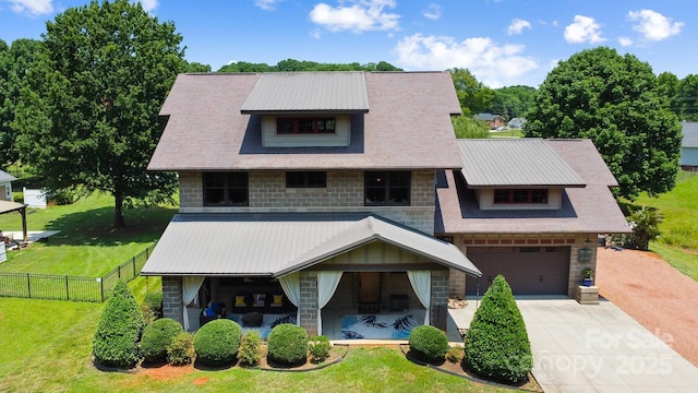 14701 Cabarrus Rd, Mint Hill, NC 28227 - view of front facade featuring concrete driveway, stone siding, an attached garage, and metal roof