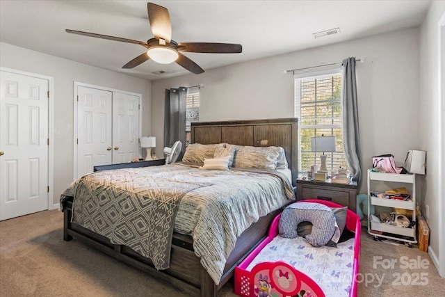 bedroom with multiple windows, carpet floors, and ceiling fan