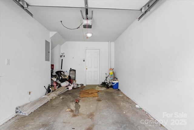 garage featuring electric panel and a garage door opener