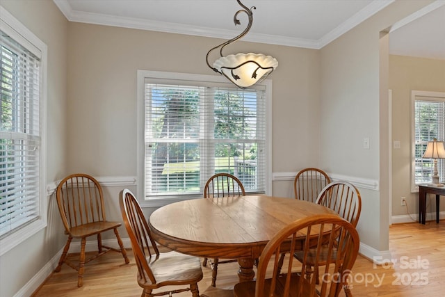 3124 17th Street Ln NE, Hickory, NC 28601 - dining space with light wood-type flooring, crown molding, and baseboards