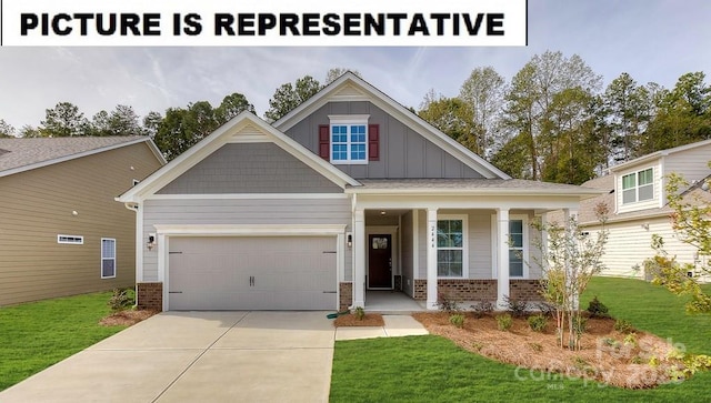 121 S Shayna Rd, Troutman, NC 28166 - craftsman-style house featuring board and batten siding, an attached garage, a front yard, and covered porch
