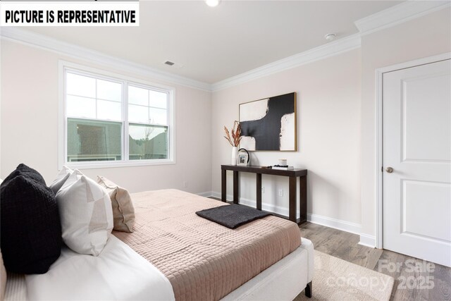 121 S Shayna Rd, Troutman, NC 28166 - bedroom with wood finished floors, ornamental molding, and baseboards