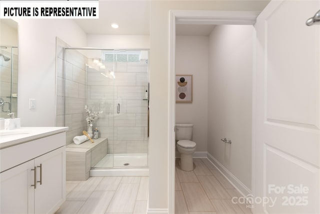 121 S Shayna Rd, Troutman, NC 28166 - bathroom with a stall shower, toilet, vanity, and baseboards
