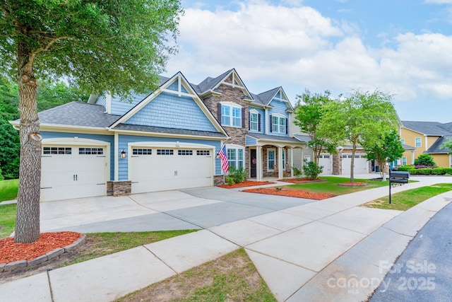 3666 Jacinta Ct, Tega Cay, SC 29708 - view of front of property with stone siding, a garage, driveway, and roof with shingles