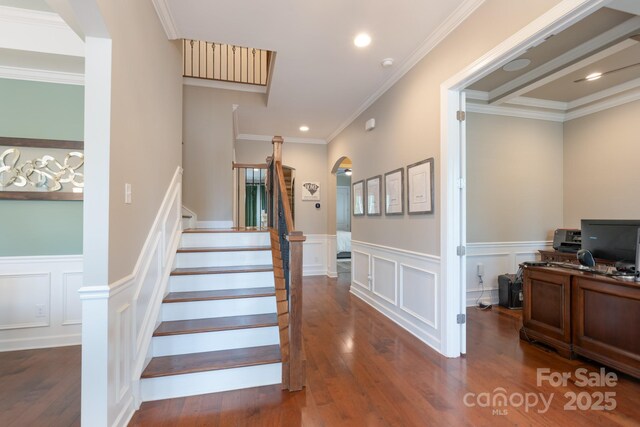 3666 Jacinta Ct, Tega Cay, SC 29708 - staircase with wainscoting, wood finished floors, a decorative wall, crown molding, and recessed lighting