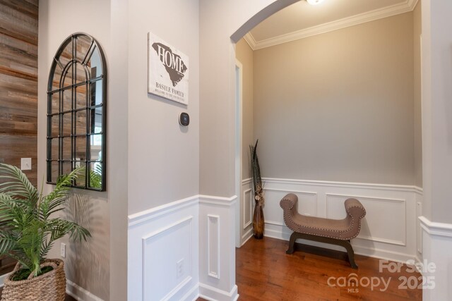 3666 Jacinta Ct, Tega Cay, SC 29708 - corridor featuring arched walkways, crown molding, wood finished floors, and a wainscoted wall