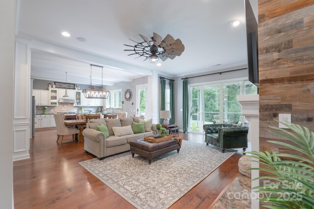 3666 Jacinta Ct, Tega Cay, SC 29708 - living area featuring hardwood / wood-style flooring, ceiling fan, recessed lighting, and a chandelier