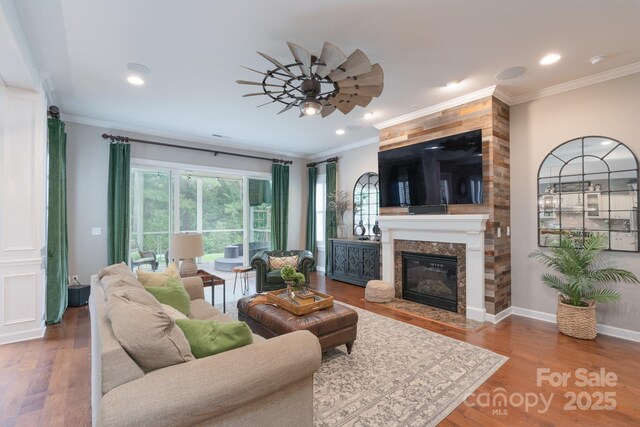 3666 Jacinta Ct, Tega Cay, SC 29708 - living room featuring a ceiling fan, a premium fireplace, recessed lighting, wood finished floors, and baseboards
