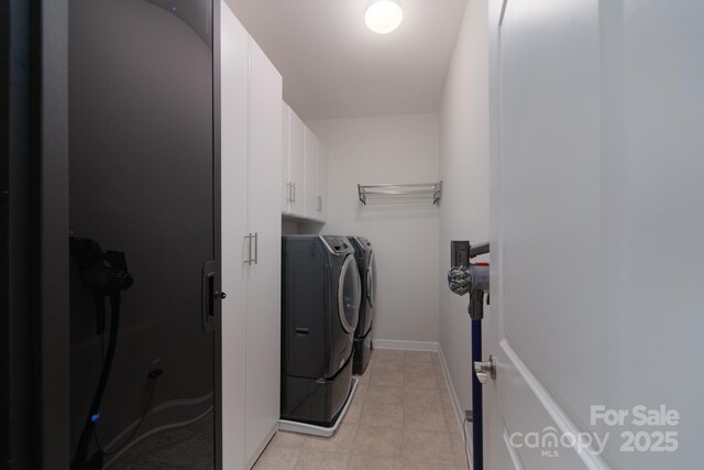 3666 Jacinta Ct, Tega Cay, SC 29708 - washroom with washing machine and dryer, cabinet space, light tile patterned floors, and baseboards