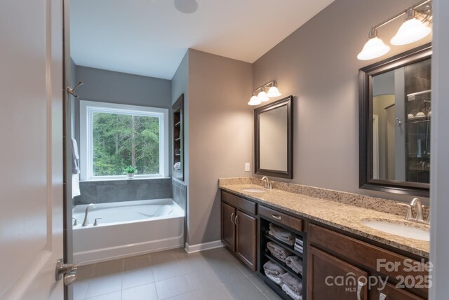 3666 Jacinta Ct, Tega Cay, SC 29708 - bathroom with tile patterned floors, double vanity, baseboards, and a bath