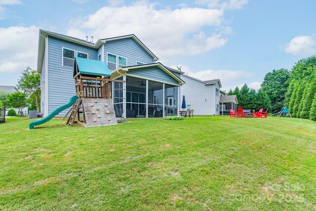 3666 Jacinta Ct, Tega Cay, SC 29708 - rear view of property with a playground, a sunroom, a lawn, and ceiling fan