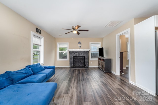 319 Leonard Ave, Albemarle, NC 28001 - living area with ceiling fan, dark wood-style floors, a fireplace, and baseboards